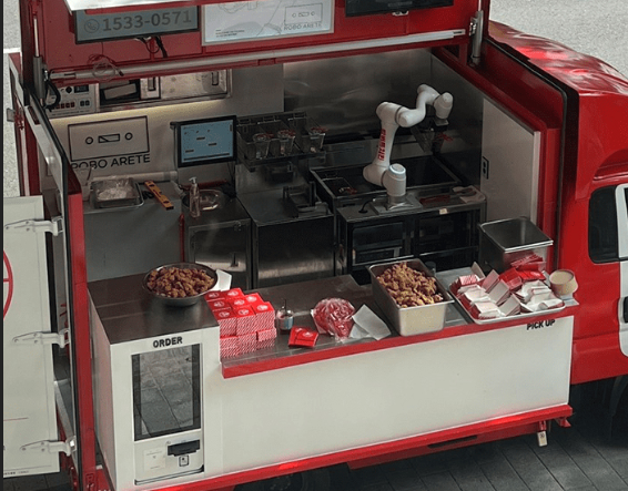 A compact automatic frying robot installed in a small food truck space, rapidly and safely cooking menu (or chickens, french fries). This low-cost startup solution helps achieve maximum revenue with minimal staff.